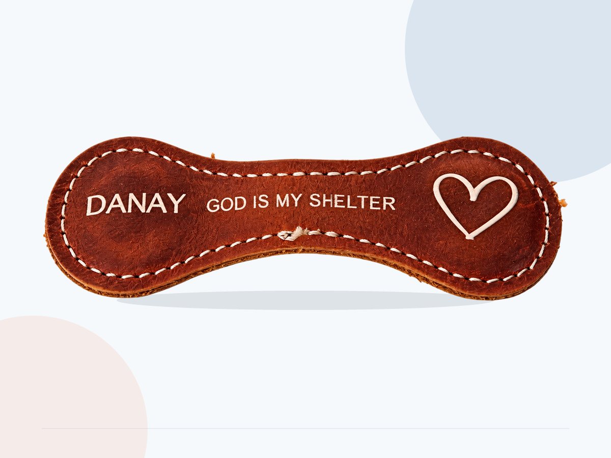 Full view of white lettering printed on brown leather